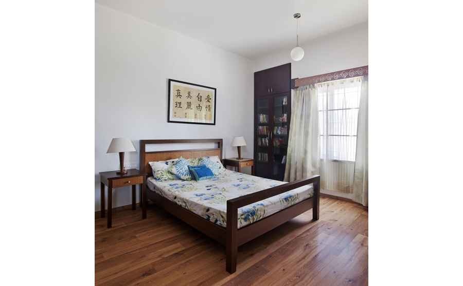 Guest Bedroom with Wooden Flooring