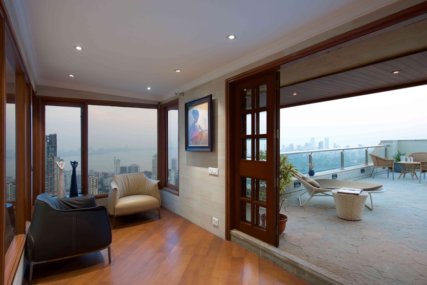 The private den opens out to a sweeping view of the cityscape.