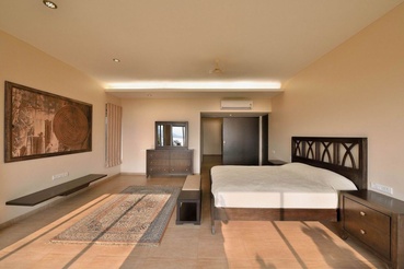 Large Master Bedroom with Glass Windows