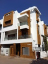 Building exteriors in white and wood finish